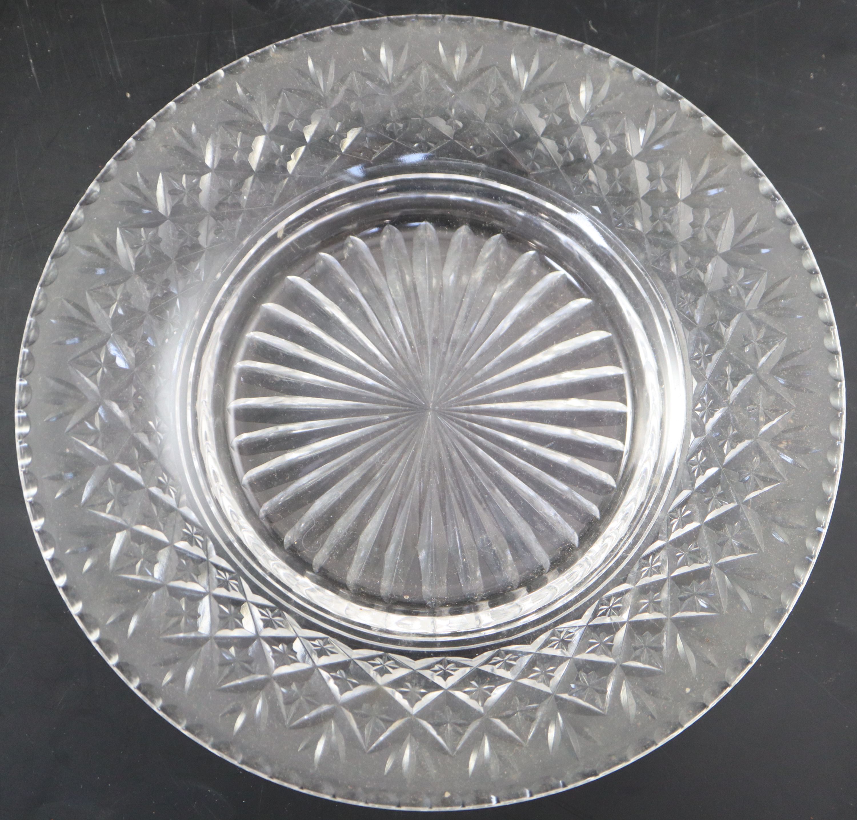 A set of twelve cut glass crescent shaped hors doeuvres dishes,